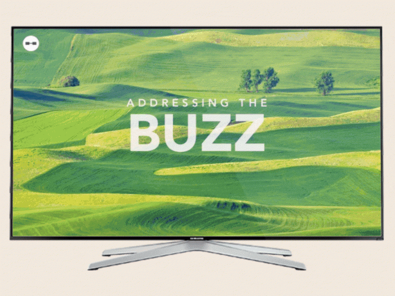 A scenic landscape of rolling green hills displayed on a television screen.