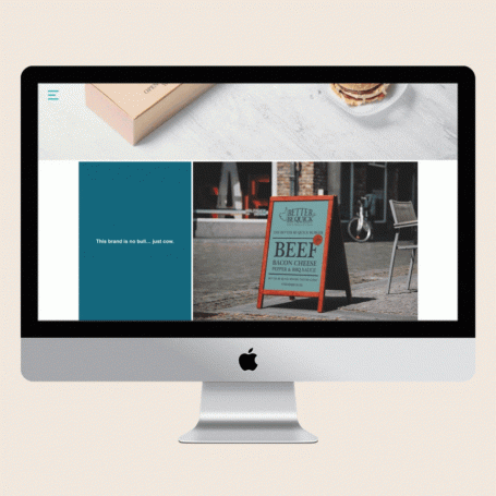A digital mockup of a website featuring a café sign and a teal section.